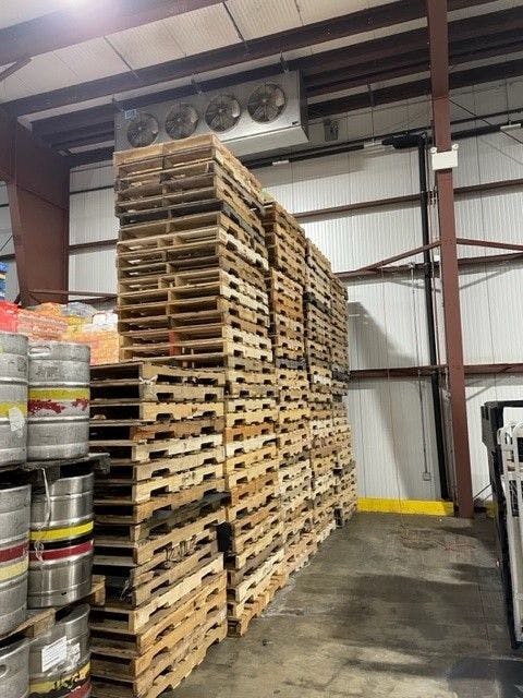 Stack of Grade B Pallets in Warehouse